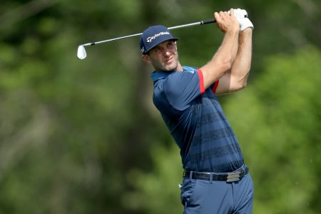 HARTFORD, WI - JUNE 15: Dustin Johnson of the United States plays his tee shot on the par 3, 16th hole during the first round of the 117th US Open Championship at Erin Hills on June 15, 2017 in Hartford, Wisconsin. (Photo by David Cannon/Getty Images)