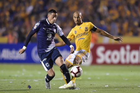 MONTERREY, MEXICO - APRIL 23: Rogelio Funes Mori, #7 of Monterrey, fights for the ball with Hugo Ayala, #4 of Tigres, during the final first leg match between Tigres UANL and Monterrey as part of the CONCACAF Champions League 2019 at Universitario Stadium on April 23, 2019 in Monterrey, Mexico. (Photo by Azael Rodriguez/Getty Images)