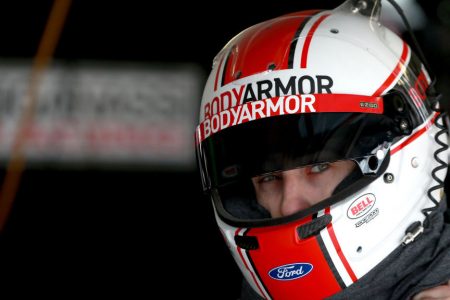 KANSAS CITY, KS - MAY 10: Ryan Blaney, driver of the #12 BodyArmor Ford, stands in the garage during practice for the Monster Energy NASCAR Cup Series Digital Ally 400 at Kansas Speedway on May 10, 2019 in Kansas City, Kansas. (Photo by Sean Gardner/Getty Images)