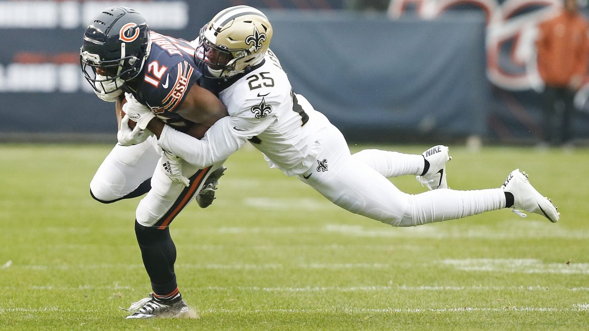 CHICAGO, ILLINOIS - OCTOBER 20: Allen Robinson #12 of the Chicago Bears is tackled by Eli Apple #25 of the New Orleans Saints during the first half at Soldier Field on October 20, 2019 in Chicago, Illinois. (Photo by Nuccio DiNuzzo/Getty Images)