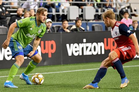 SEATTLE, WASHINGTON - SEPTEMBER 18: Jordan Morris #13 of Seattle Sounders looks to move the ball against Alex Muyl #19 of New York Red Bulls during the match at CenturyLink Field on September 18, 2019 in Seattle, Washington. The match ended in a 0-0 draw. (Photo by Alika Jenner/Getty Images)