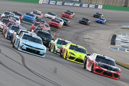 SPARTA, KY - JULY 12: Christopher Bell (20) Joe Gibbs Racing (JGR) Toyota Supra and Noah Gragson (9) JR Motorsports Chevrolet Camaro lead the field to a restart during the Alsco 300 on July 12, 2019, at Kentucky Speedway in Sparta, Kentucky. (Photo by Michael Allio/Icon Sportswire via Getty Images)