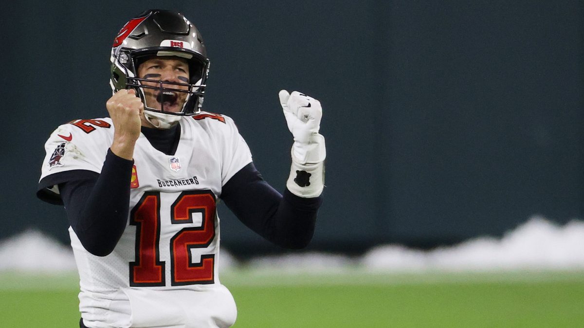 GREEN BAY, WISCONSIN - JANUARY 24: Tom Brady #12 of the Tampa Bay Buccaneers celebrates in the final seconds of their 31 to 26 win over the Green Bay Packers during the NFC Championship game at Lambeau Field on January 24, 2021 in Green Bay, Wisconsin. (Photo by Dylan Buell/Getty Images)