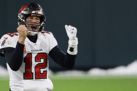 GREEN BAY, WISCONSIN - JANUARY 24: Tom Brady #12 of the Tampa Bay Buccaneers celebrates in the final seconds of their 31 to 26 win over the Green Bay Packers during the NFC Championship game at Lambeau Field on January 24, 2021 in Green Bay, Wisconsin. (Photo by Dylan Buell/Getty Images)