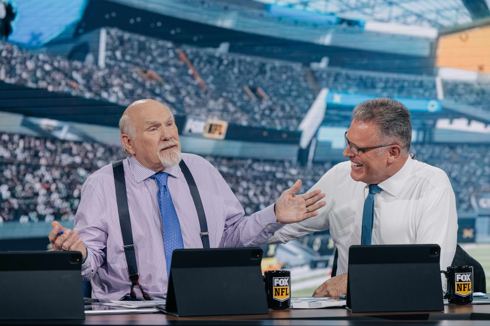 Terry Bradshaw making Howie Long laugh during rehearsals