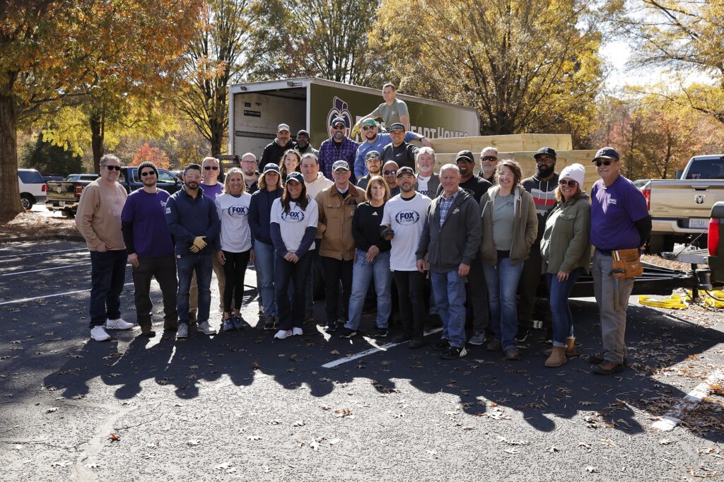 FOX Sports volunteers and Purple Heart Homes staff build wheelchair ramps
